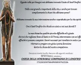 A statue of Saint Onofrio, a hermit with long hair and beard, holding a staff and rosary.
