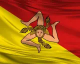 Bandiera siciliana con la Trinacria. Chi esce, riesce a raggiungere i propri obiettivi con determinazione.