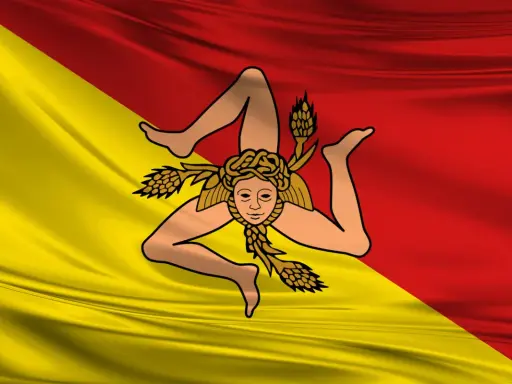 Bandiera siciliana con la Trinacria. Chi esce, riesce a raggiungere i propri obiettivi con determinazione.