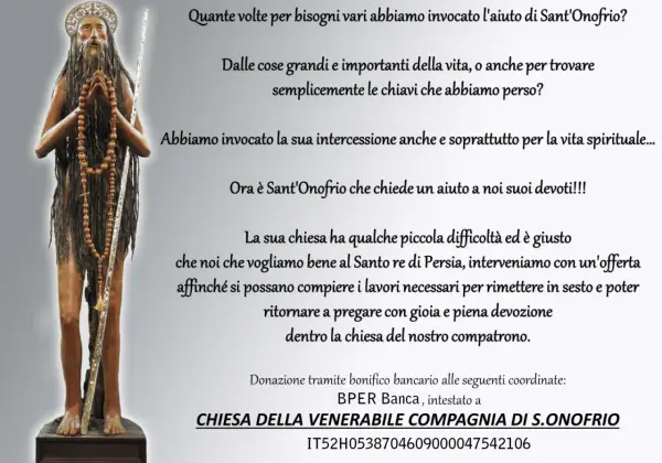 A statue of Saint Onofrio, a hermit with long hair and beard, holding a staff and rosary.